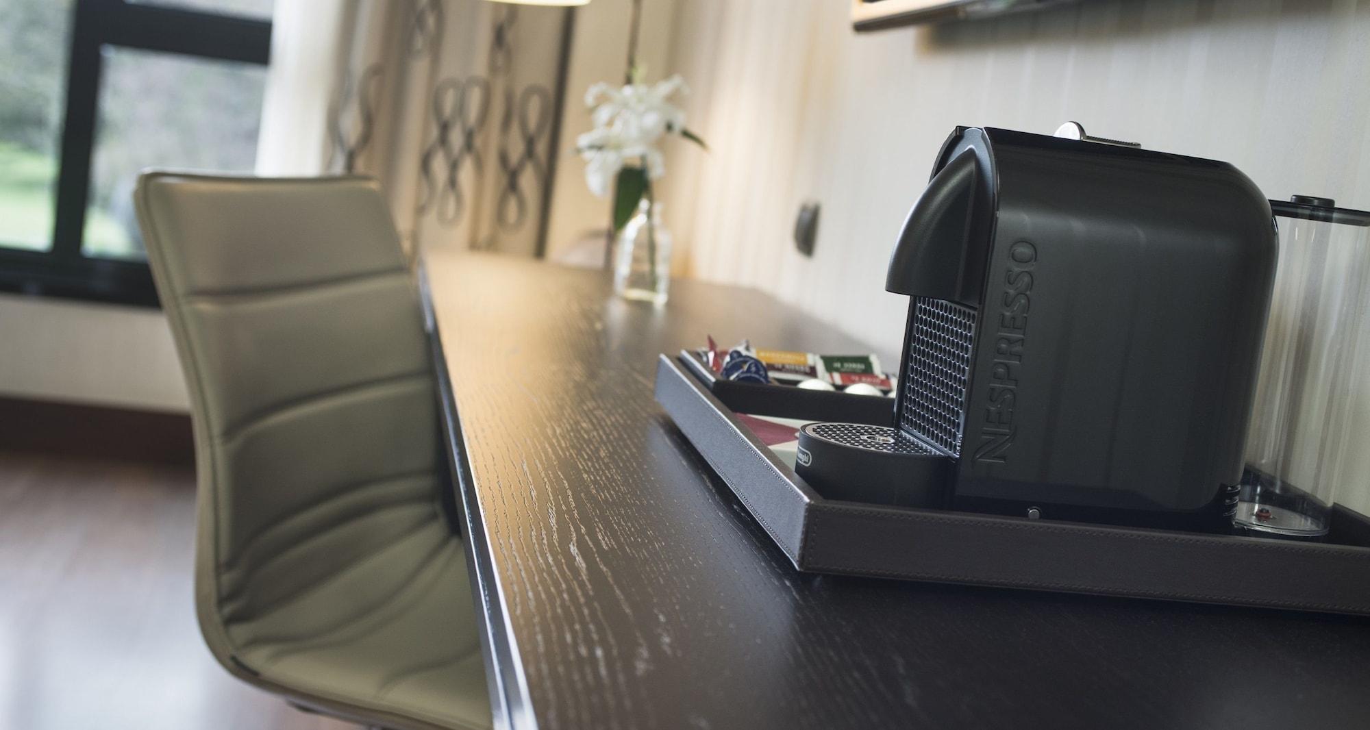 Palacio De Aviles Affiliated By Melia Exteriör bild A Nespresso machine in a hotel